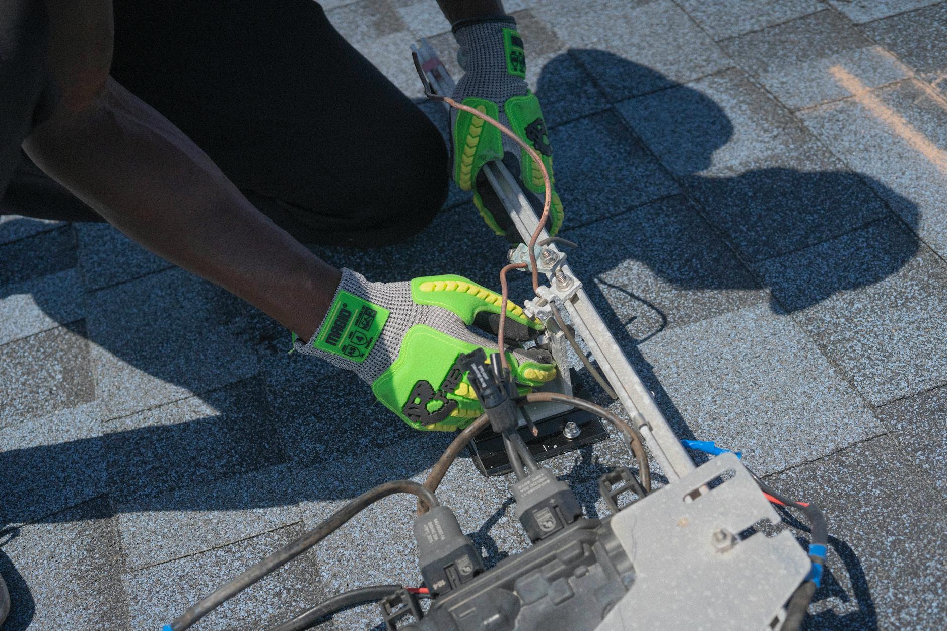 A licensed roofing contractor from Tri Peak Roofing discussing a cool roof coating with a homeowner in Henderson, Nevada.