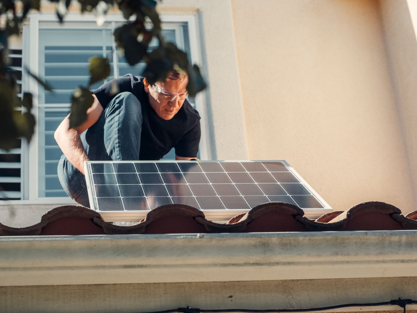 A professional Tri Peak Roofing team member discussing a roof inspection report with a homeowner in front of a Summerlin South residence.